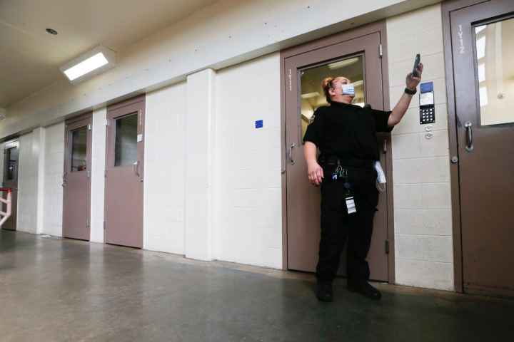 A guard at Shawnee County Jail makes routine rounds