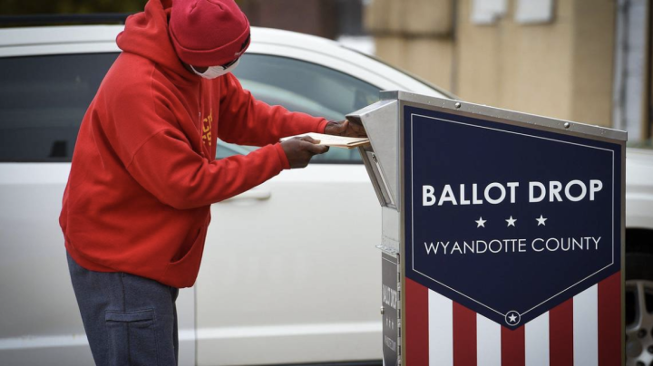 A voter drops off their ballot at a drop box in Wyandotte County during the 2020 election. TAMMY LJUNGBLAD tljungblad@kcstar.com  Read more at: https://www.kansascity.com/news/local/article279738504.html#storylink=cpy