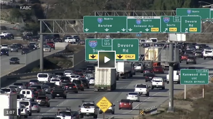 Screenshot of a video newstory; cars in traffic on Kansas highway