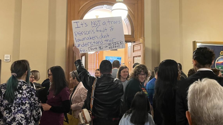 Sign reading, "It's NOT a trans Person's fault if lawmakers don't understand their life."