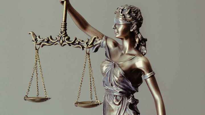 Blindfolded Lady Justice holding scales