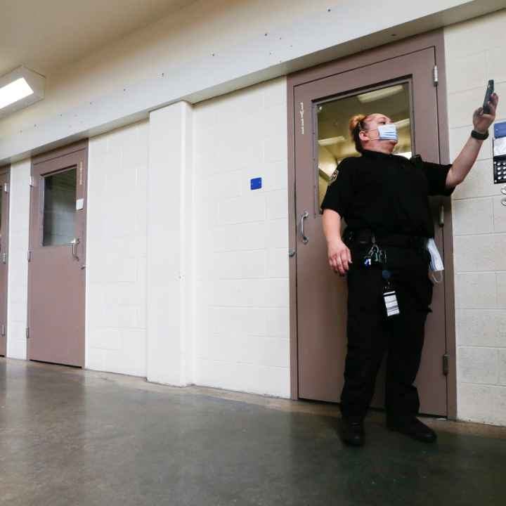 A guard at Shawnee County Jail makes routine rounds