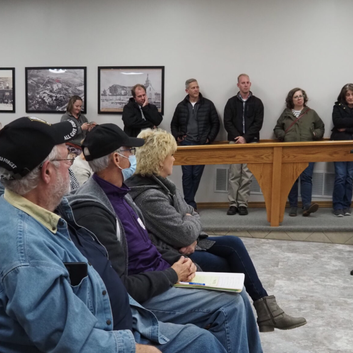  St. Marys residents line the walls to listen to the discussion of the library’s lease renewal during a Nov. 15, 2022, city commission meeting. (Rachel Mipro/Kansas Reflector)