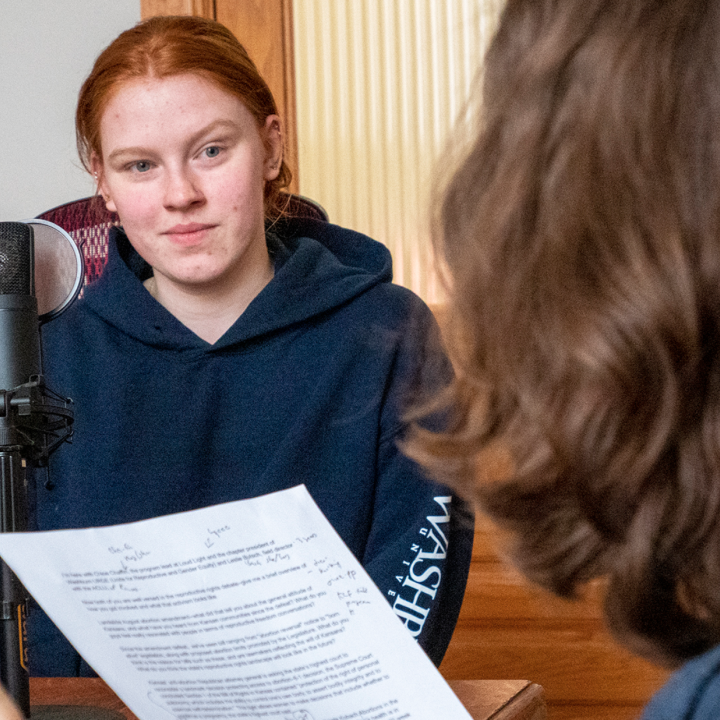 Chloe Chaffin, facing the camera, appears with Kansas Reflector reporter Rachel Mipro for a podcast recording on March 23, 2023, at the Kansas Reflector office in downtown Topeka. (Sherman Smith/Kansas Reflector)