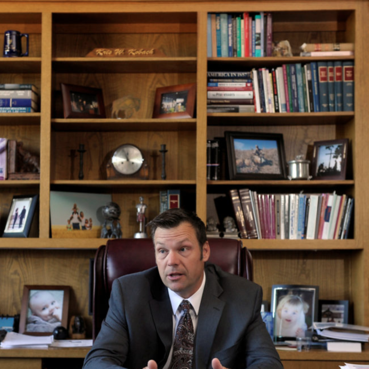 Left: FILE PHOTO: Former Kansas Secretary of State Kris Kobach in his Topeka, Kansas, office May 12, 2016. Photo by Dave Kaup/REUTERS