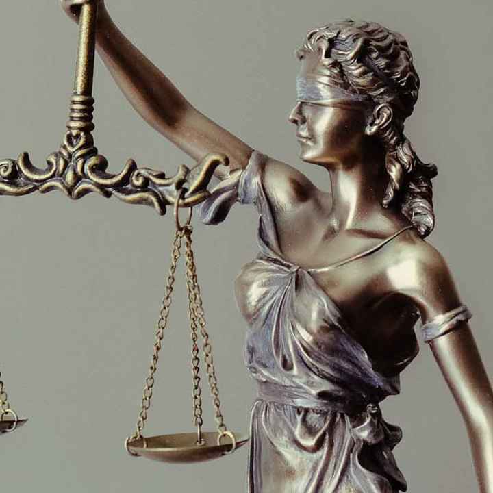 Blindfolded Lady Justice holding scales