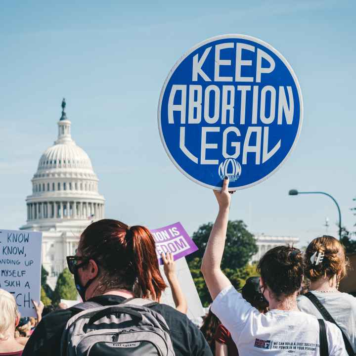 Rally at capitol featuring sign that reads, "Keep abortion legal"