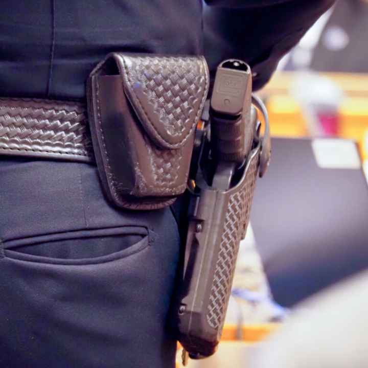 gun on hip of officer